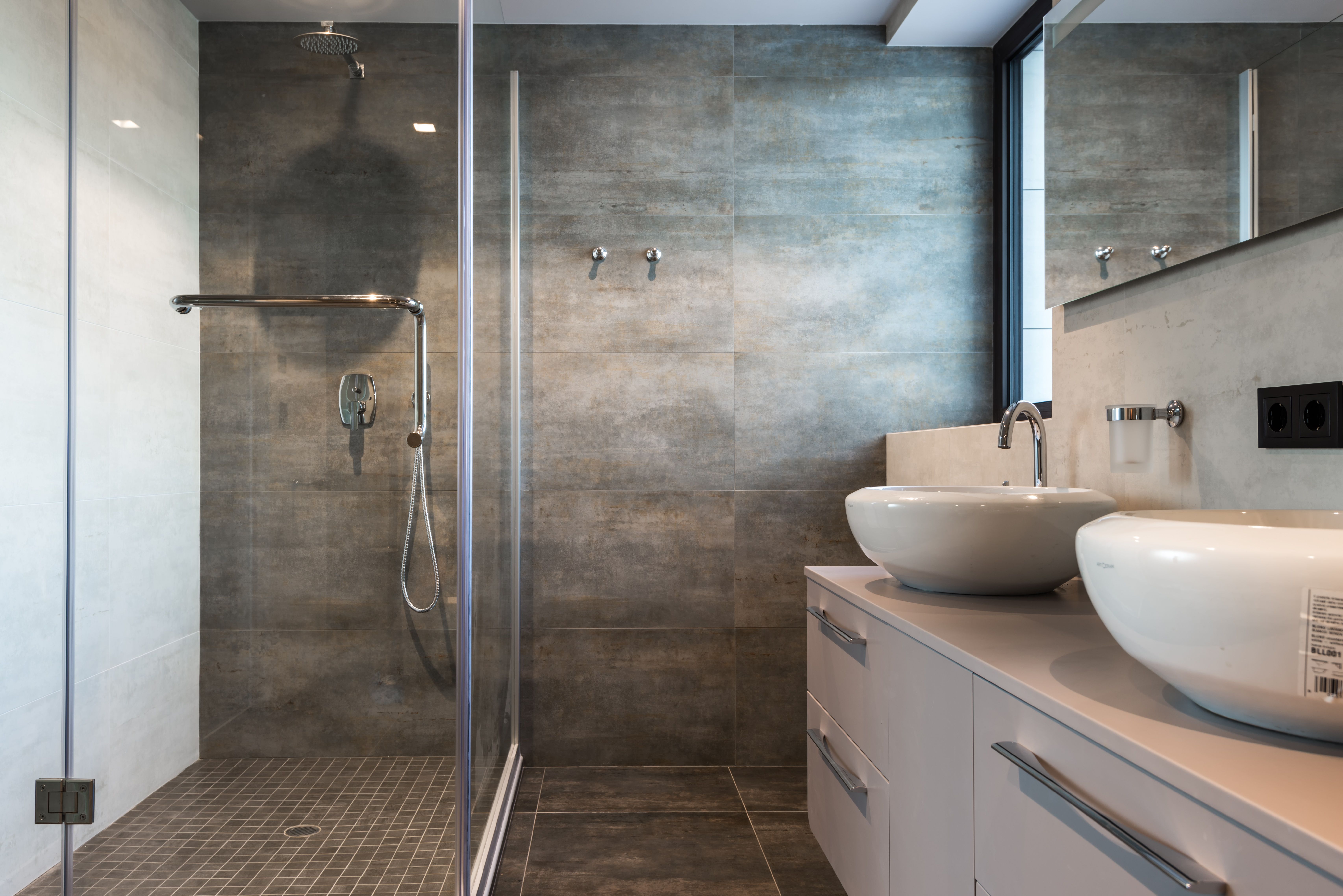 Renovated spa-like bathroom with premium tile work